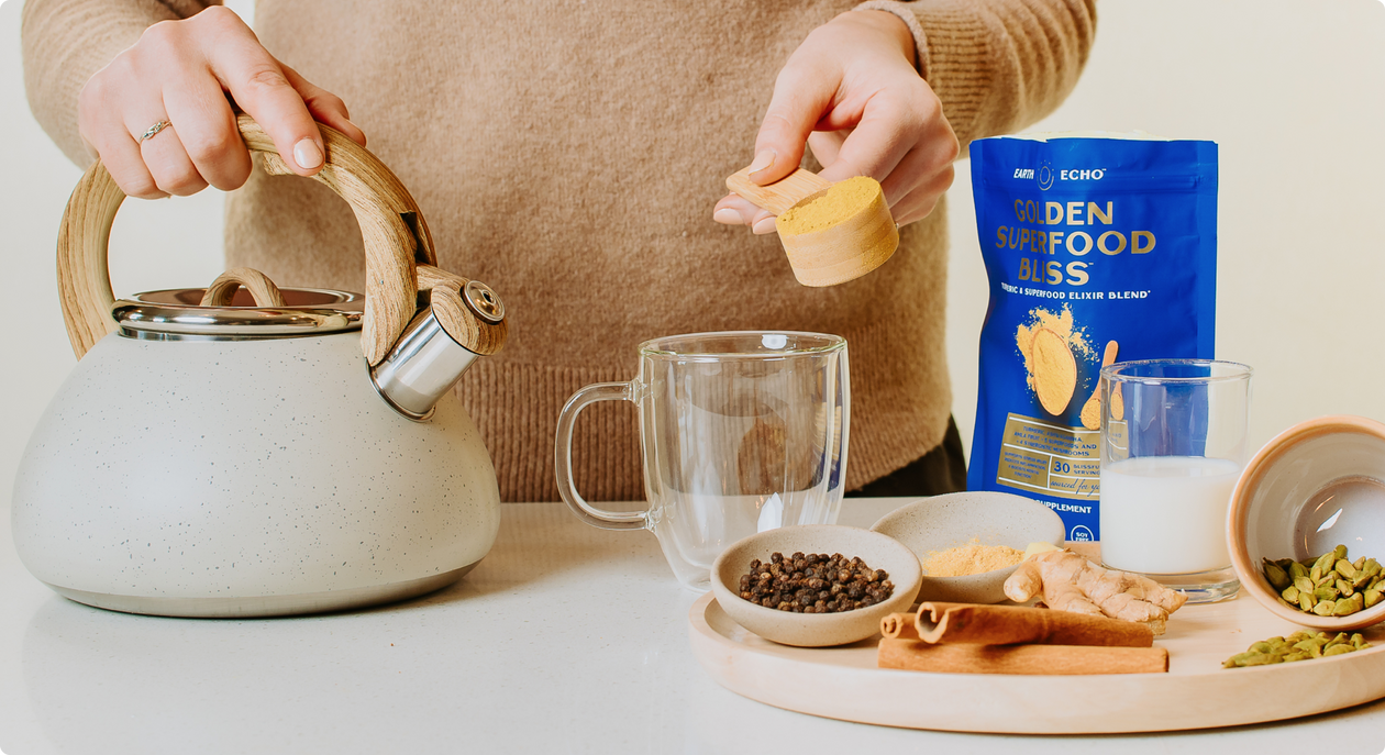 Woman making an Earth Echo Golden Superfood Bliss drink